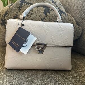 Creamy beautiful purse, good size and fit everything